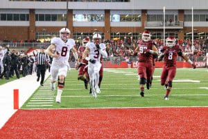 Fifth-year senior quarterback Kevin Hogan (far left) scores his second rushing touchdown of the evening on a 59-yard touchdown run after pulling the ball on a read-option. The score gave Stanford its first lead of the night at 27-22. Hogan finished the night as Stanford's leading rusher with 112 yards on the ground and 2 rushing touchdowns. (BOB DREBIN/isiphotos.com)