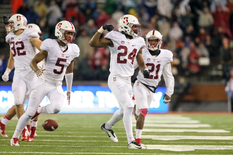 Freshman nickelback Quenton Meeks (center) celebrates after his second interception of the night against Washington State, which set Stanford up with great field position to eventually take a 30-28 lead on a 19-yard Conrad Ukropina field goal. He also set up a Stanford touchdown drive in the third quarter with his first pick. On this interception, Meeks identified that Washington State quarterback Luke Falk was going to throw a screen pass and jumped the route for an easy takeaway. (BOB DREBIN/isiphotos.com)