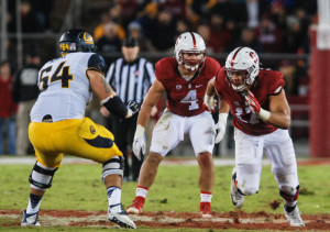 Senior linebacker Blake Martinez (center) finished second on the team with 9 tackles, while fifth-year senior Brennan Scarlett (right) won the Axe for the first time in his career
