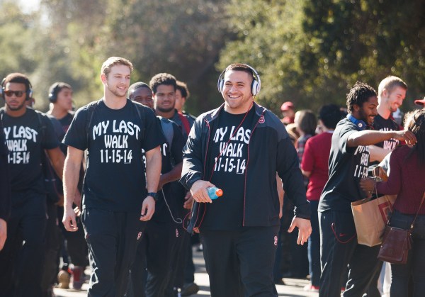 Every year, Stanford's seniors do their "Last Walk" ahead of their Senior Day celebration in their final game at Stanford Stadium. David Parry (right) leads last year's senior class in the Last Walk ahead of the Utah game a year ago. (DAVID ELKINSON/stanfordphoto.com)