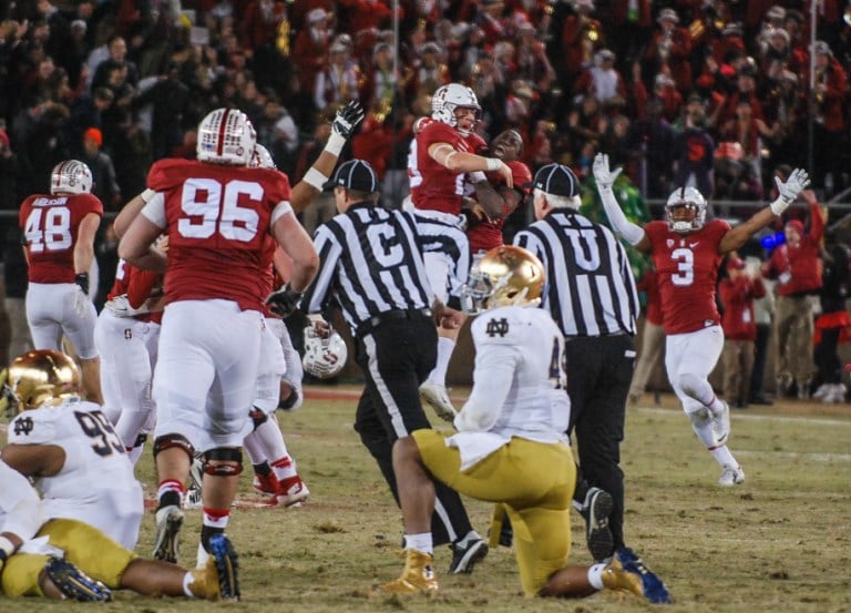 Stanford celebrates on the field after senior kicker Conrad Ukropina's kick from 45 yards perfectly split the uprights, giving Stanford a thrilling 38-36 win over Notre Dame in a back-and-forth duel that featured career nights from Kevin Hogan and Devon Cajuste in their home finale. (SAM GIRVIN/The Stanford Daily)