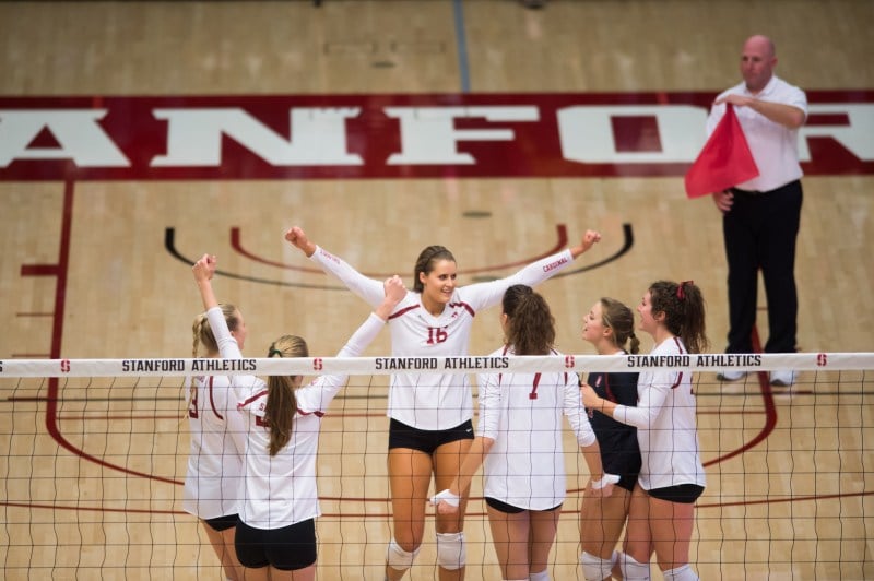 Stanford's three seniors, Brittany Howard (center), Madi Bugg (second from left) and Jordan Burgess (far right), closed their home careers with a bang in a 3-1 win over California in the Big Spike on Wednesday. They became just the second senior class in the last 15 years to go undefeated against Cal in conference play over four full seasons. (RAHIM ULLAH/The Stanford Daily)