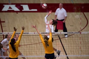 Outside hitter Jordan Burgess (top) notched 8 kills and 6 digs against Cal. Stanford outhit Cal as a whole, .333 to .276, in the Big Spike. (RAHIM ULLAH/The Stanford Daily)