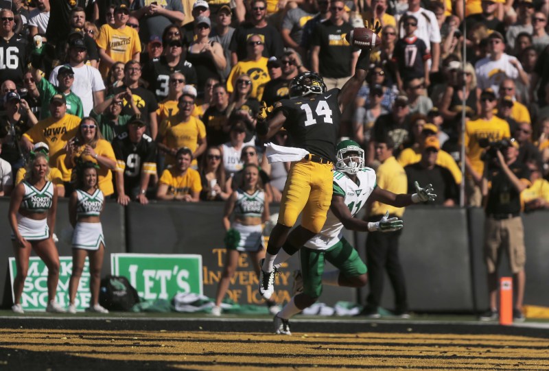 Iowa defensive back Desmond King (left) blocks a pass meant for North Texas wide receiver Thaddeous Thompson during the Iowa-North Texas game in Kinnick Stadium on Saturday, Sept. 26, 2015. The Hawkeyes defeated the Mean Green, 62-16. (Margaret Kispert/The Daily Iowan)