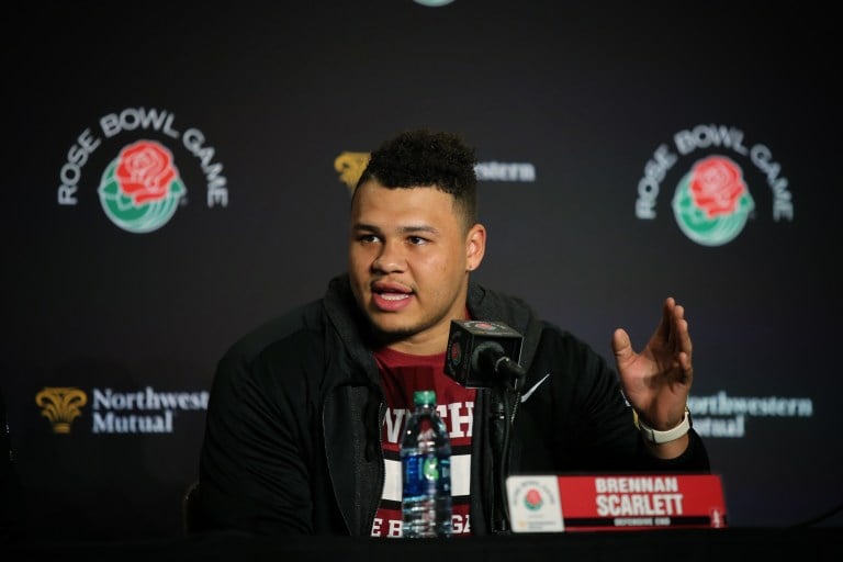 Fifth-year senior defensive end Brennan Scarlett (center) has been going up against his brother, Cameron, in practice since the younger Scarlett has been tasked with emulating Iowa running back Jordan Canzeri in practices. (DON FERIA/isiphotos.com)