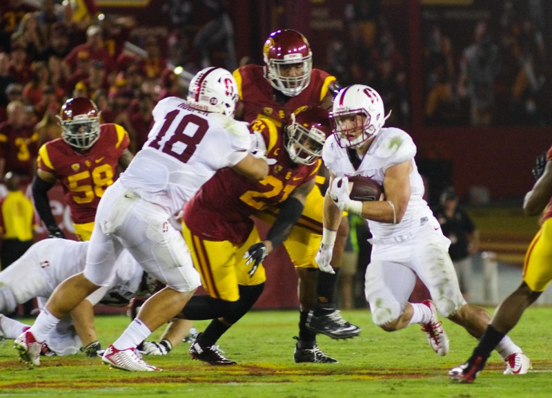 With USC linebackers Cameron Smith and Lamar Dawson out, sophomore running back Christian McCaffrey (right) will likely see his workload increase in his second game of the season against the Trojans. Last time the teams squared off, McCaffrey became Stanford's first 100-yard rusher since 2013. (SAM GIRVIN/The Stanford Daily)