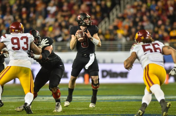 Although fifth-year senior quarterback Kevin Hogan only threw the ball 12 times on a run-heavy day for the Cardinal, he didn't have an incomplete pass after the first quarter and accounted for rushing, receiving and passing touchdowns to push Stanford to victory. (SAM GIRVIN/The Stanford Daily)