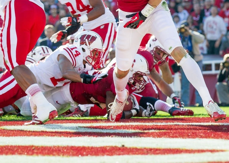 Stepfan Taylor (center) was a co-MVP in the 2013 Rose Bowl, despite only rushing 89 yards, well below his season average. Nevertheless, the Cardinal still came out with a 20-14 win over Wisconsin. (JIM SHORIN/stanfordphoto.com)