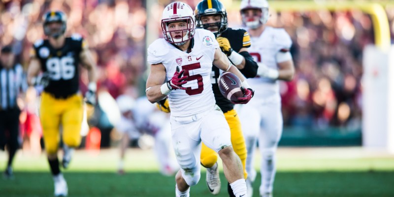 Sophomore running back Christian McCaffrey (center) became the first player in Rose Bowl history to go over both 100 rushing and receiving yards with his 172 rushing and 105 receiving yards against the Hawkeyes. It was his third time accomplishing that feat this season. (RAHIM ULLAH/The Stanford Daily)