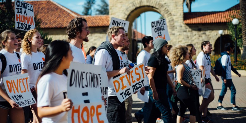 Fossil Free Stanford protests for divestment in the quad. The group announced it will not be giving Senior Gifts until Stanford divests. (ASH NGU/The Stanford Daily)