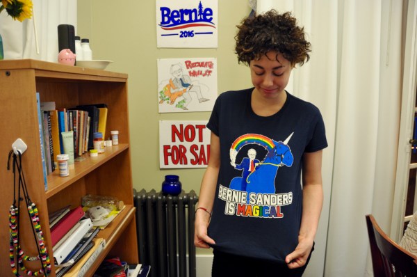 Carla Genai Lewis, co-founder of Stanford Students for Bernie, shows off some of her campaign gear. (Allison Harman/The Stanford Daily)