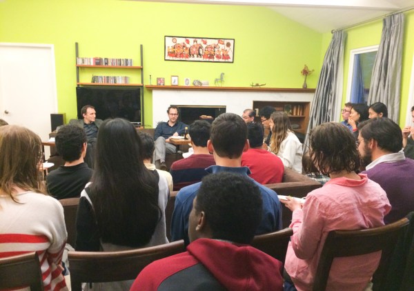 Students and faculty discuss the purpose of studying the humanities at the home of Nadeem Hussain, dean of FroSoCo. (FANGZHOU LIU/The Stanford Daily)