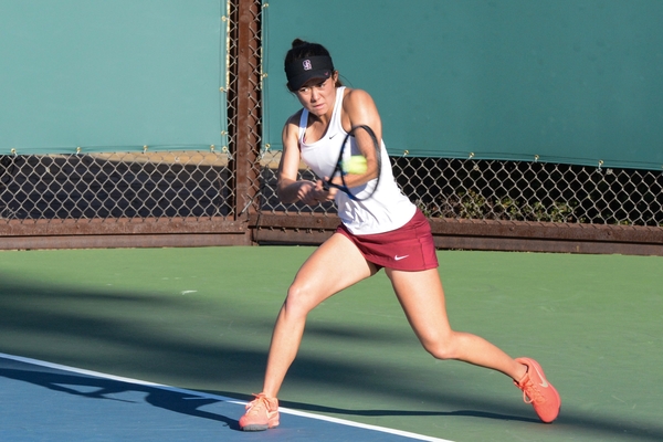 Although the match was already clinched, freshman Kimberly Yee (above) pulled off a nail-biting 6-1, 5-7, 1-0 (13-11) victory for the Cardinal on Court 6. Yee's win was just one of many for Stanford on Friday, as the team swept Fresno State 7-0. (NEEL RAMACHANDRAN/The Stanford Daily)