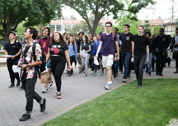 The activist group Who's Teaching Us led a march on Friday to protest what they see as inadequate funding of community centers, among other issues. (ROBERT SHI/The Stanford Daily)