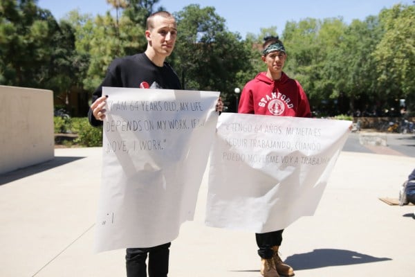 Student showed solidarity with custodial staff at SALA's Monday rally (ROBERT SHI/The Stanford Daily).
