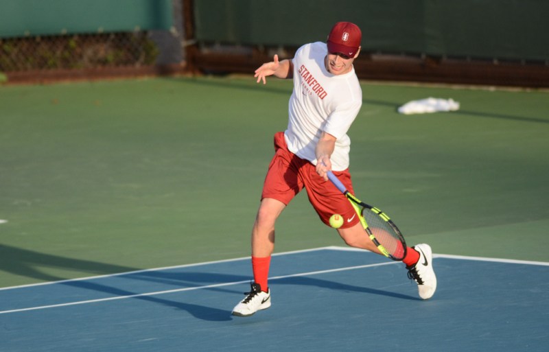 Freshman Michael Genender (above) saw his match on Court 2 abandoned as the Cardinal took the doubles point but couldn't do any singles damage against the Pac-12 champion Bruins. (SAM GIRVIN)