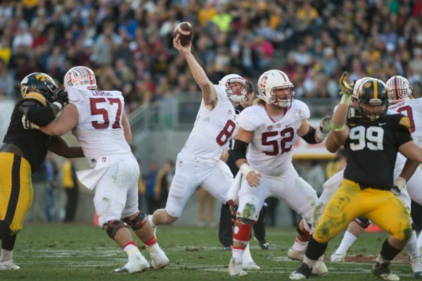 Kevin Hogan (center) could climb draft boards and be taken higher than a lot of people think based on the premium put on quarterbacks in this year's draft class. (RAHIM ULLAH/The Stanford Daily)
