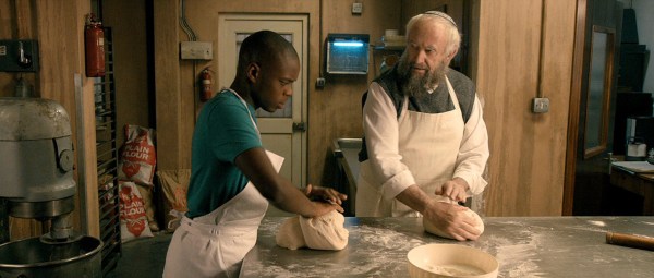 (l-r) Jerome Holder and Jonathan Pryce star in "Dough." (Courtesy of Menemsha Films)