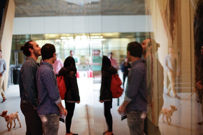 The reflective surface of the Moghadam Gallery is one of the limited art display spaces available to students. (ELIJAH NDOUMBÉ/The Stanford Daily)