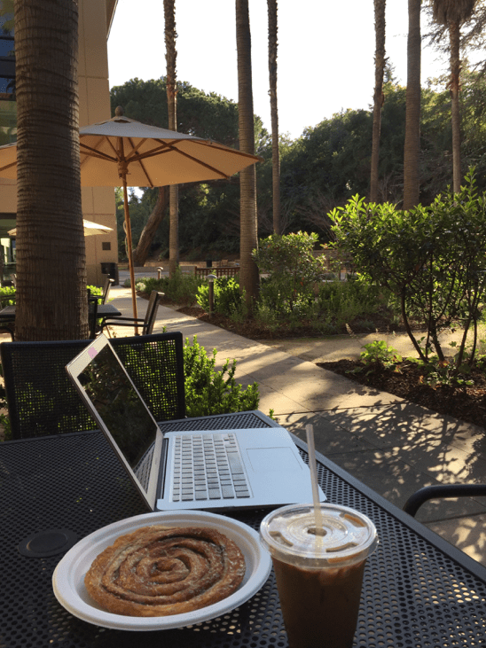 Iced coffee and a cinnamon swirl at the Alumni Café (SAMANTHA WONG/The Stanford Daily)