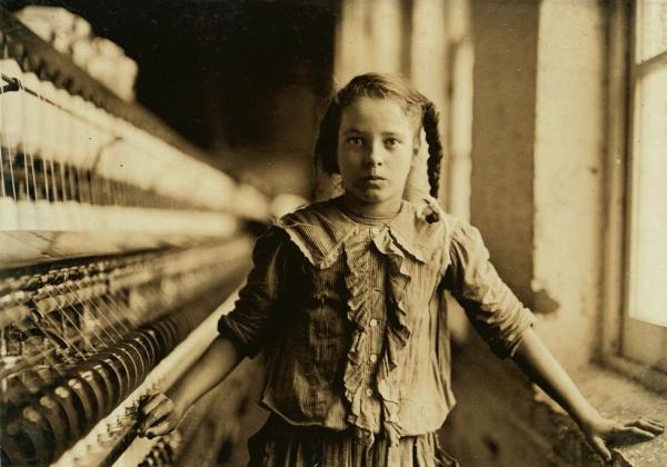 Lewis Hine's bewitching 1908 photograph of a young spinner, one of many works by Hine on display in "Soulmaker", a new exhibit at the Cantor Arts Center.