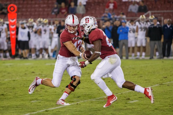Senior Ryan Burns (left) was confirmed as starting quarterback with the release of the 2016 depth chart. Junior Keller Chryst and freshman K.J. Costello will be available as his backups. (ROGER CHEN/The Stanford Daily)