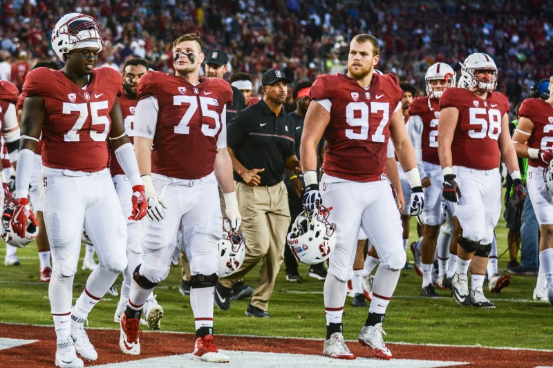 With defensive lineman Harrison Phillips likely sidelined with a knee injury, fifth-year senior Jordan Watkins (left) will get the start at defensive tackle when the Cardinal take on USC. In other injury-related news, no announcement has been made as to the availability of sophomore running back Bryce Love, who sat out the season opener with a leg injury. (SAM GIRVIN/The Stanford Daily)