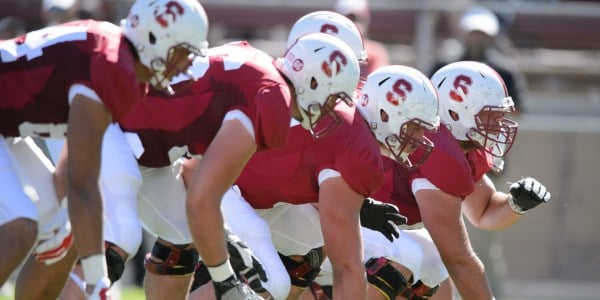 Stanford's offensive line uses both their overpowering physicality and intellect, each boasting separate majors in various disciplines, in order to dominate the trenches. (JOHN TODD/isiphotos.com)