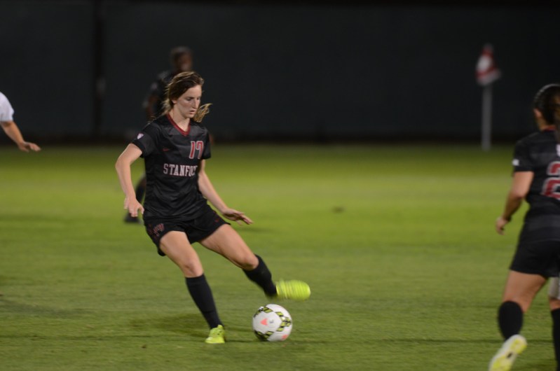Junior midfielder Andi Sullivan prepares to kick the ball past an incoming defender. Sullivan has ben an essential piece for the Cardinal as both a defender and an offender, boasting the second-highest number of goals for the Cardinal.
(ERIN ASHBY/The Stanford Daily)