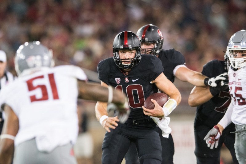 Junior quarterback Keller Chryst (center) had mixed results after starting against Arizona instead of senior Ryan Burns, going 14-for-30 with 104 yards, two touchdowns and one interception. (RAHIM ULLAH/The Stanford Daily)