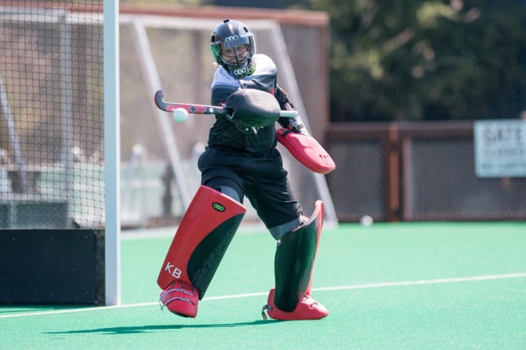 Freshman goalie Kelsey Bing blocks a shot, helping lead her team to victory. Bing has been an important newcomer to the team, earning recognition via multiple America East personal titles. (LYNDSAY RADNEDGE/isiphotos.com)