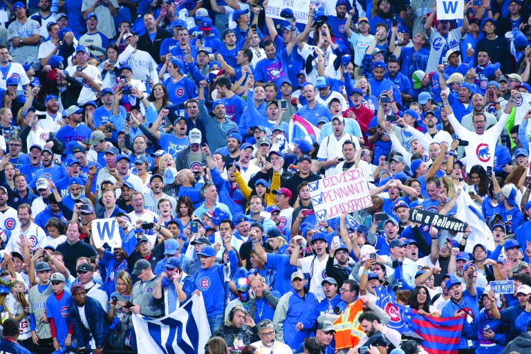 Cubs fans celebrate the Chicago Cubs winning the World Series at the end of Game 7 between the Chicago Cubs and Cleveland Indians Thursday, Nov. 3, 2016, at Progressive Field in Cleveland, Ohio. (John J. Kim/Chicago Tribune/TNS)