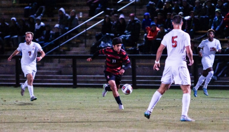 Sophomore Amir Bashti kicked the 10th of 10 penalty kicks for the Cardinal in Friday's semifinal victory. (LARRY GE/The Stanford Daily)