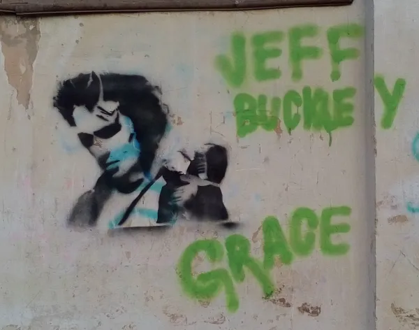 Graffiti featuring an image of Jeff Buckley as well as the word "Grace," which refers to Buckley's renowned album of the same name. (Wikimedia Commons, Romchikthelemon)