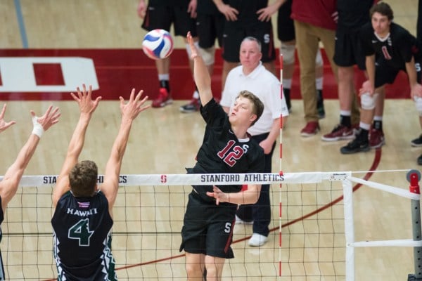 Sophomore Jordan Ewert goes for the kill as hsi opponents try to block from the other side of the net. Ewert is currently leading the team in kills and digs. (RAHIM ULLAH/The Stanford Daily)