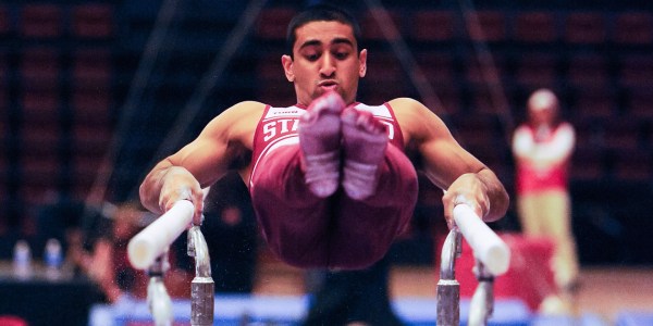 Senior Akash Modi delivered another dominant performance at the Stanford Invitational, claiming top spot in the all-around, floor, pommel horse, and parallel bars. (MIKE KHEIR/The Stanford Daily)