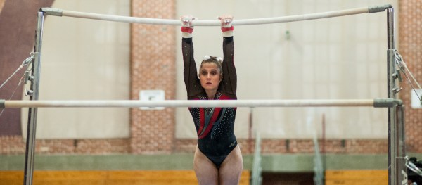 Senior Nicolette McNair finished in first place on bars with a score of 9.875. McNair and three other seniors were recognized on Friday for their contributions over four seasons. (RAHIM ULLAH/The Stanford Daily)