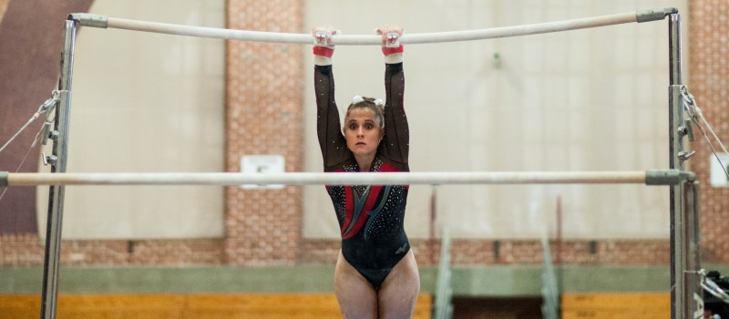 Senior Nicolette McNair finished in first place on bars with a score of 9.875. McNair and three other seniors were recognized on Friday for their contributions over four seasons. (RAHIM ULLAH/The Stanford Daily)