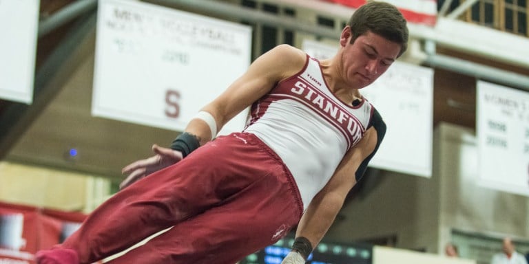 Junior Robert Neff posted a 15.500 on high bar, the highest score seen this season. Despite a valiant comeback attempt, Stanford ultimately fell to Oklahoma by .250 points. (RAHIM ULLAH/The Stanford Daily)