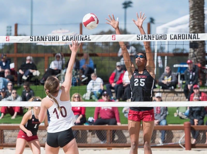 Sophomore Courtney Bowen attempts a block against Santa Clara on Friday. Bowen and freshman Kat Anderson, paired at the No.5 spot, won their four matches this weekend as Stanford advanced to a 4-0 record (DAVID BERNAL/isiphotos.com).