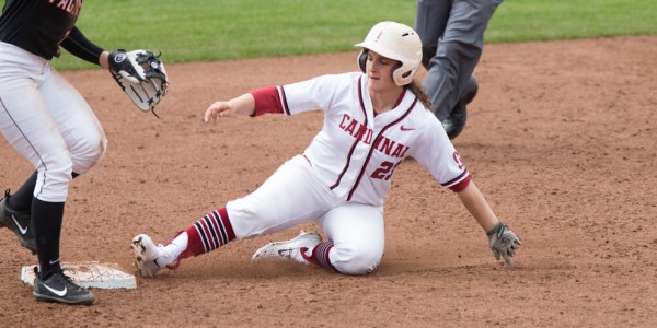 Freshman utility Teaghan Cowles slides into base, gaining grounds for the Cardinal. Cowles is one of the two leading runners on the team. (MIKE RASAY/isiphotos.com)
