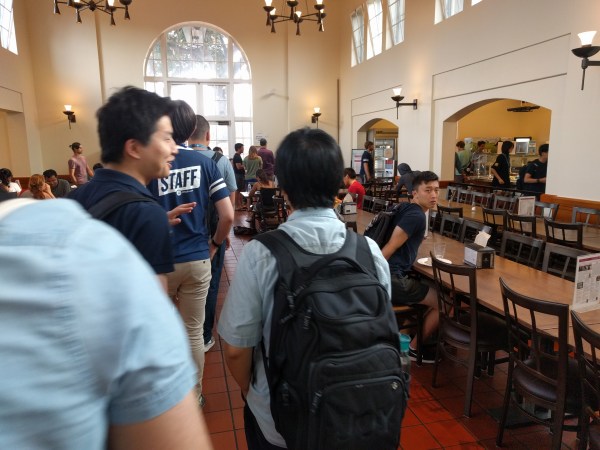 Students wait in line for a meal at Lakeside Dining. (Regan Pecjak/The Stanford Daily)