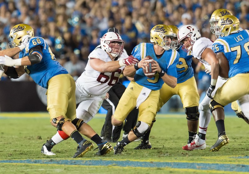 Stanford senior defensive tackle Harrison Phillips (66, above) had a sack against UCLA quarterback Josh Rosen in last year's matchup. Phillips will be needed again to pressure Rosen as the Bruins field a high-powered offense.(DAVID BERNAL/isiphotos.com)