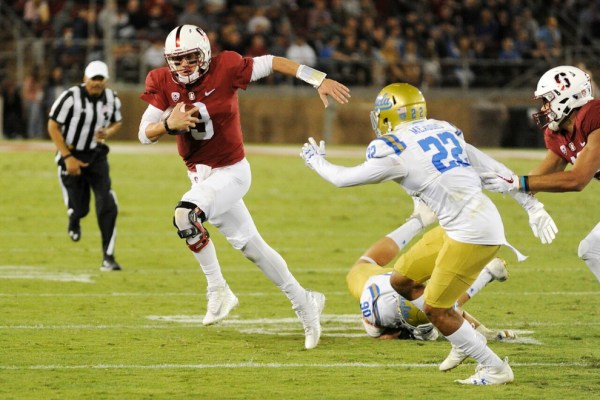 Sophomore quarterback K.J. Costello (left) came in  when senior starter Keller Chryst went down in the first quarter. Costello threw 13-of-19 for 123 yards and two touchdowns in the win over UCLA.(MICHAEL KHEIR/The Stanford Daily)