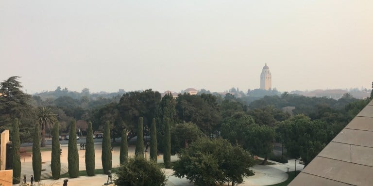 Smoke fills the sky above Stanford and Hoover Tower