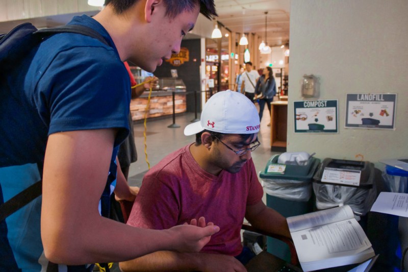 Student receiving help from a LaIR tutor (KEVIN RIERA/The Stanford Daily).