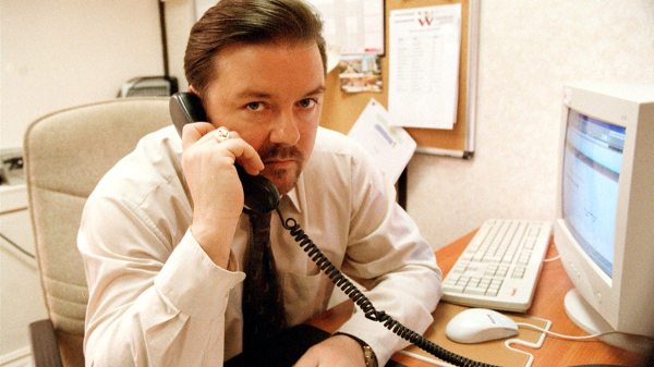 David Brent (Ricky Gervais) makes a phone call on the UK version of "The Office" (Courtesy of BBC).