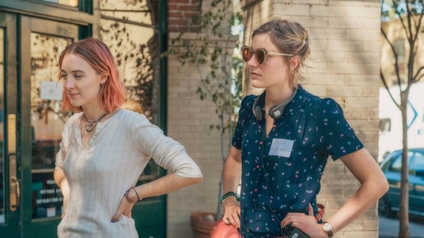 Greta Gerwig (right) directs Saoirse Ronan on the set of Gerwig's film "Lady Bird." (Courtesy of A24.)