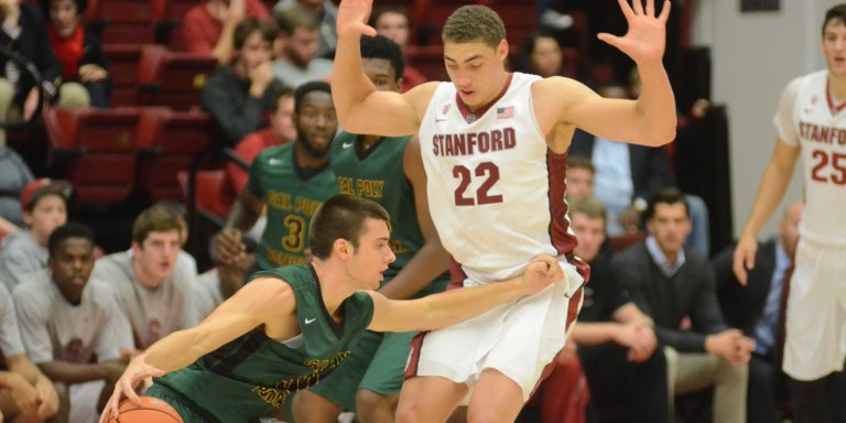 Senior forward Reid Travis (22, above) is the Pac-12's returning leading scorer (17.4 points per game) and rebounder (8.9 rebounds per game).(LAUREN DYER/The Stanford Daily)