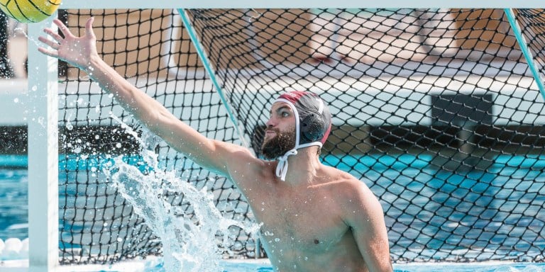 Senior Drew Holland recorded four saves in one quarter of action against Santa Clara, becoming the first Cardinal goalie to reach the 900-save mark. (BILL DALLY/isiphotos.com)